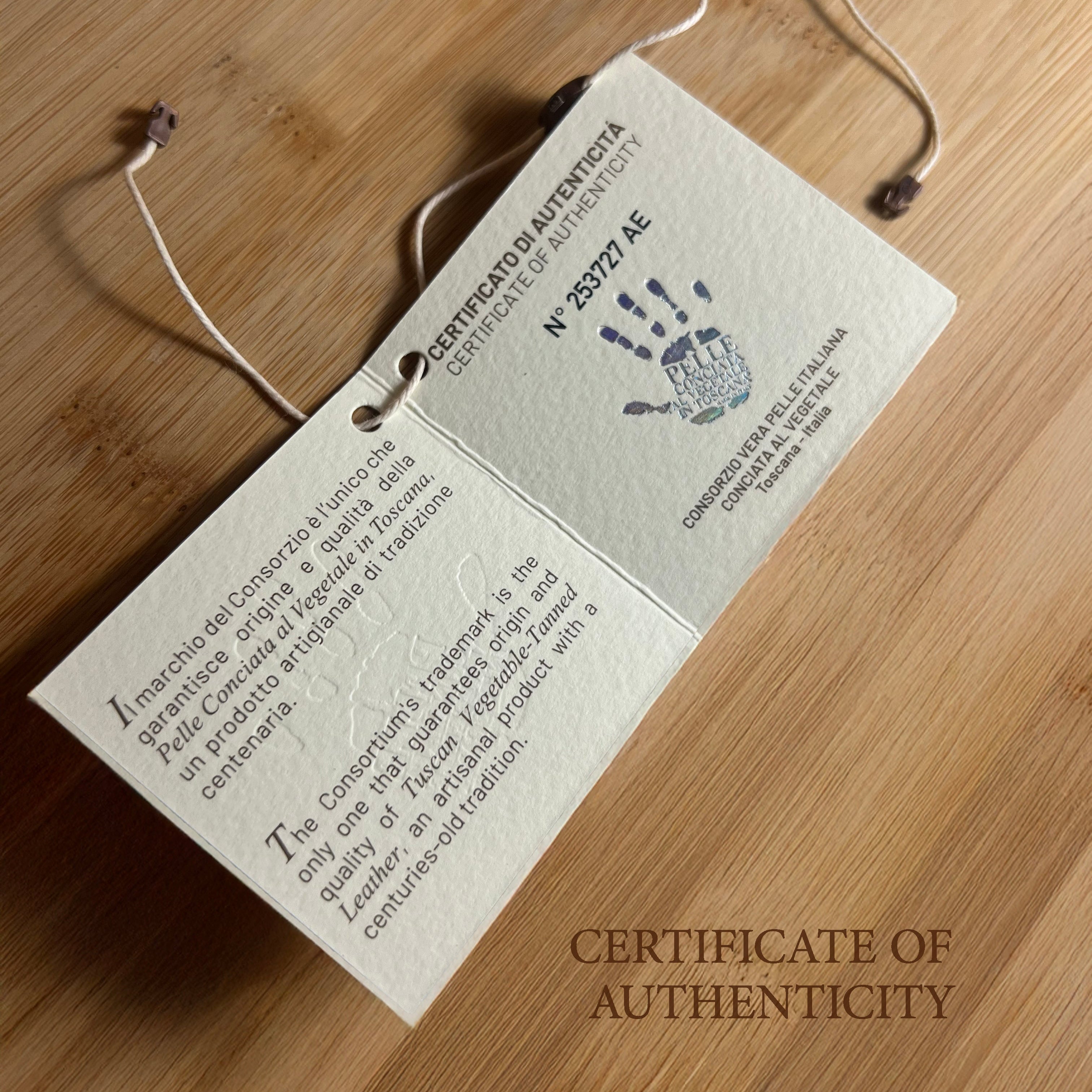Certificate of Authenticity with handprint on a wooden surface