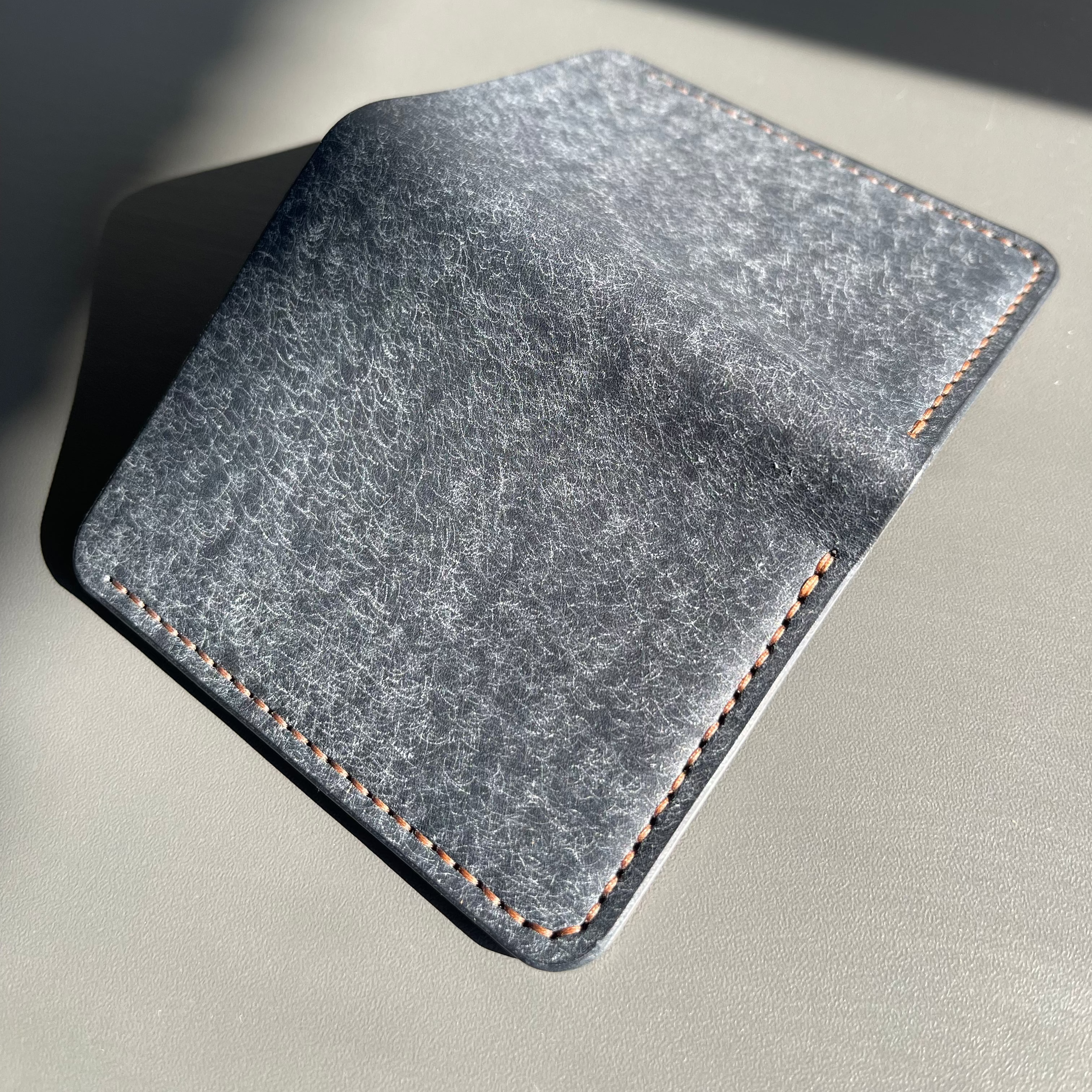 Gray felt mouse pad on a light gray surface